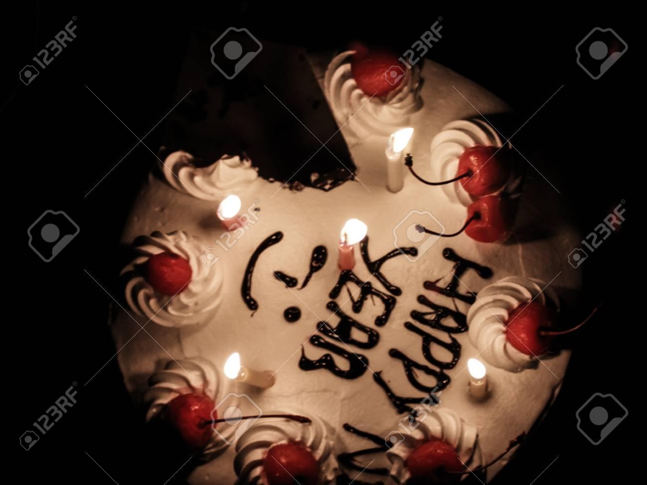 large.1895405300_78131330-happy-new-year-cake-missing-a-piece-with-a-candle010421.jpg